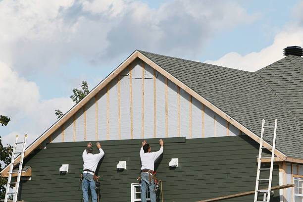 Professional Siding Replacement technician working in Midland, PA
